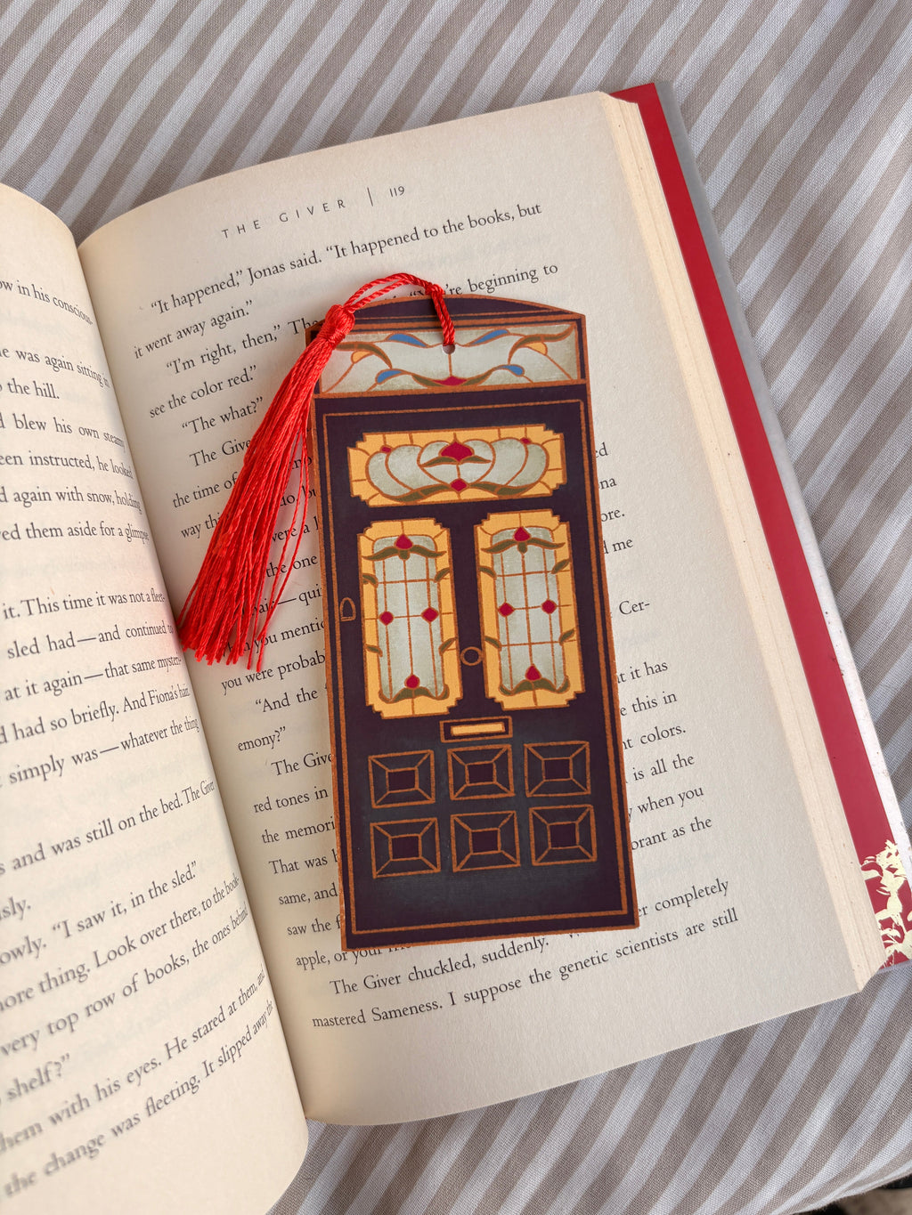 Decorative bookmark with tassel on an open book