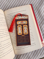 Decorative bookmark with tassel on an open book